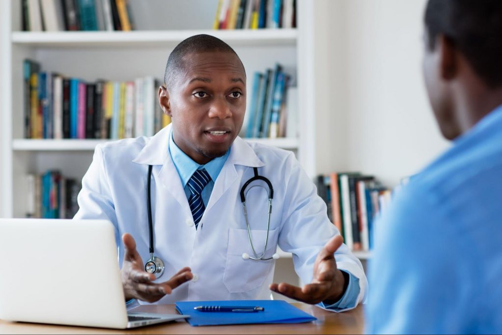 a male doctor explaining the top questions about seo to his patient