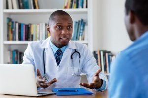 a male doctor explaining the top questions about seo to his patient