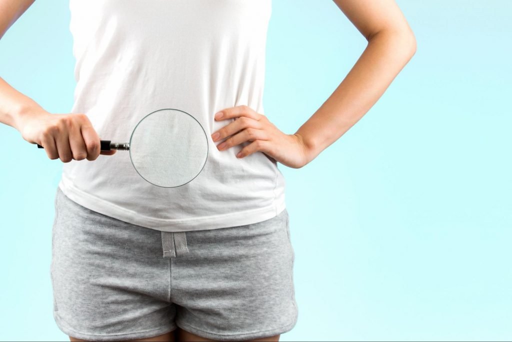 a magnifying glass placed in front of the bladder to represent 4 Ways to Improve Your Bladder Health